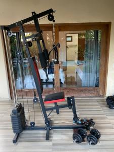 a gym with a treadmill and a room at Casa das Alpinias - Trancoso in Trancoso