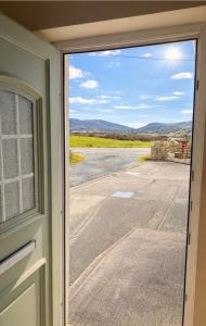 a door with a view of a road outside at Sonnys Rest in Ardara +12 photos