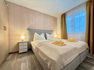 Postel nebo postele na pokoji v ubytování Treehouse - Alpinlake Apartments