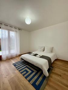 Postel nebo postele na pokoji v ubytování Maison lumineuse Route de Boisseuil- DABNB