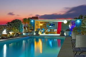 a swimming pool in a backyard with a house at Exclusive SUPER-SIZE Holiday home - 12 bed,11 bath with Amazing Facilities, Sea and Mountain Views in Tías +54 photos