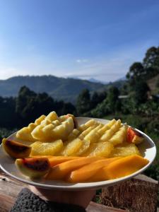 a plate of food on top of a table at Rubuguri community home in Rubuguli