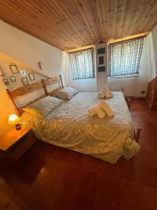 En eller flere senge i et værelse på Casa Salvatore