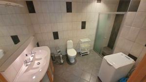 a bathroom with a sink and a toilet at Wallander's hometown, close to beach & café in Ystad +18 photos