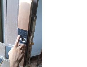 a person taking a picture of a door with their finger at Domizil Suites in Batangas City +12 photos