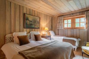 En eller flere senge i et værelse på Le Chalet l'Harmonie - Pierres d'Histoire