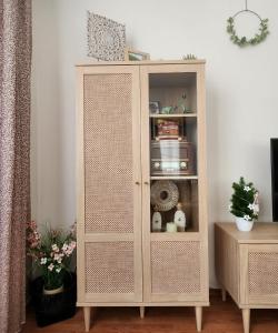 a white cabinet in a living room at Apartmán v centre Donovaly s garážou in Donovaly