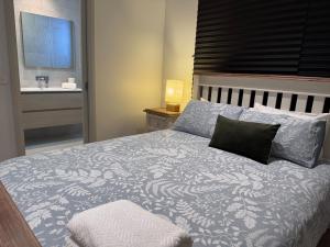a bedroom with a large bed with a window and a sink at Seas the Day - Bay Stay in Tootgarook