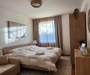 En eller flere senge i et værelse på Apartment Olivia