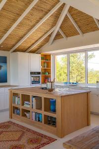 a kitchen with a large island in a room at Architectural Gem Between Risør And Kragerø in Søndeled