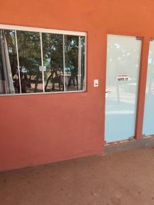 a door to a store with a sign on it at Hotel Apis Silvestre in Cruzeiro da Fortaleza