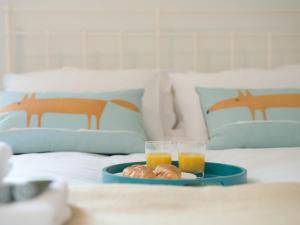 En eller flere senge i et værelse på Stable Yard Cottage + 18 billeder