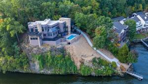 an aerial view of a house on an island in the water at The Royal Chateau-5BED6BATHPoolHottub-20PP in Osage Beach