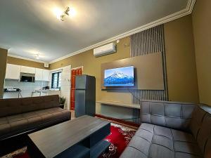 a living room with a couch and a table at Zengu in Lusaka