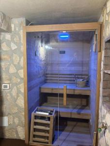 a sauna with a glass shower in a room at Meithras Holiday Homes in Agrigento