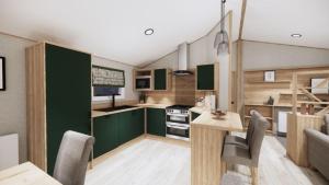 eine Küche mit grünen Schränken sowie einem Tisch und Stühlen in der Unterkunft Clumber Park Lodges in Worksop
