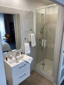 Phòng tắm tại Hôtel Restaurant l'Annexe