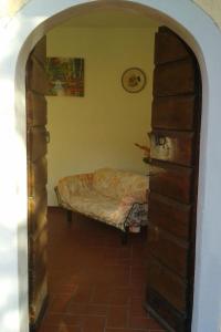 a room with a bed in the corner of a room at Apartment Jasmin by Interhome in Fauglia