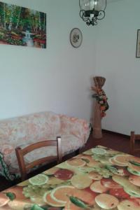 a living room with a table and a couch at Apartment Jasmin by Interhome in Fauglia