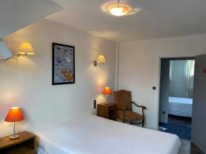 Giường trong phòng chung tại Hôtel Restaurant l'Annexe