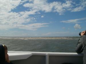 a man taking a picture of the ocean from a boat at Apartment Nice Holidays by Interhome in Pellworm