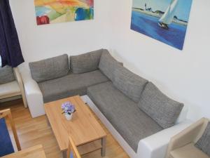 a living room with a couch and a table at Apartment Daun by Interhome in Daun +42 photos