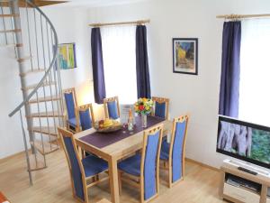 a dining room with a table and chairs at Apartment Daun by Interhome in Daun