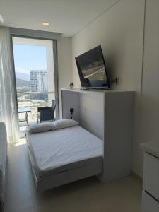 En eller flere senge i et værelse på Suite Pozos Colorados piso 14