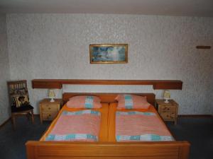 a bedroom with two beds and a picture on the wall at Apartment Schule 5 by Interhome in Windeby +8 photos