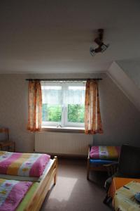 a bedroom with two beds and a window at Apartment Schule 8 by Interhome in Windeby +8 photos