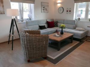 a living room with a couch and a table at Holiday Home Knut by Interhome in Mellnitz