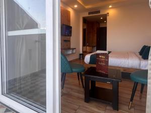 a view of a room with a bed and a window at The Pine Mountain View A Rooftop Restaurant & Luxury Balcony Rooms! in Mussoorie
