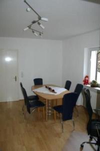 a dining room with a table and chairs at Apartment Lotta in Trochtelfingen by Interhome in Trochtelfingen