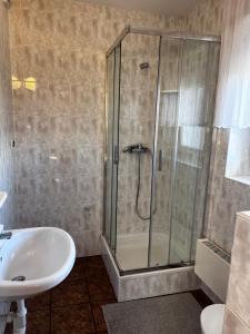 a bathroom with a shower and a sink at Szyper in Jastarnia +79 photos