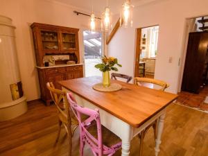 a dining room with a wooden table and chairs at Apartment Appartement mit Terrasse by Interhome in Bracht