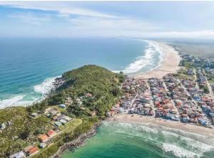 an aerial view of a beach and the ocean at Recanto da Natureza in Imbituba
