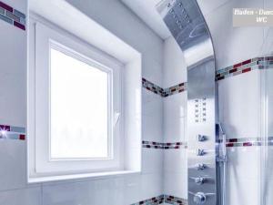 a bathroom with a window and a shower at Apartment Fe-Wohnung Augsburg by Interhome in Augsburg