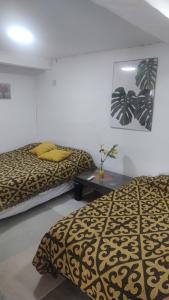 En eller flere senge i et værelse på CIRCULO Depart