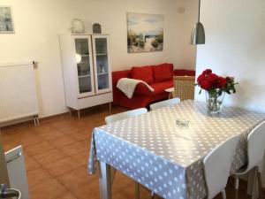 a living room with a table and a couch at Apartment in Dassow by Interhome in Feldhusen