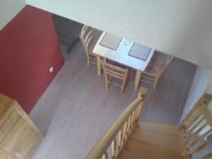 a room with a table and chairs with laptops on it at Apartment 3 by Interhome in Feldhusen