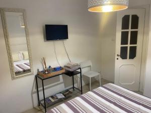 En eller flere senge i et værelse på Le Camere nel Borgo