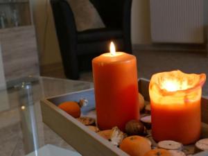 a candle and some nuts in a box with a box of cookies at Apartment Im Hof by Interhome in Pittenbach +11 photos