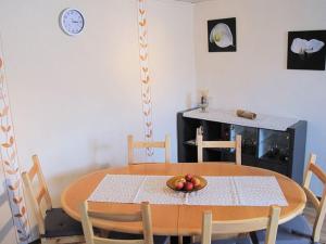 a dining room table with a bowl of fruit on it at Apartment Santa Maria by Interhome in Nettersheim