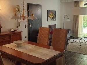 a dining room with a table and chairs and a dining room at Apartment Schomaker-Fatmann by Interhome in Rastdorf