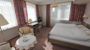 Voodi või voodid majutusasutuse Hotel Gasthaus Tröster toas