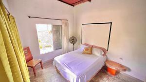 Giường trong phòng chung tại CALABAZO Casa MonoCai