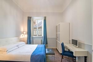 En eller flere senge i et værelse på Duomo View