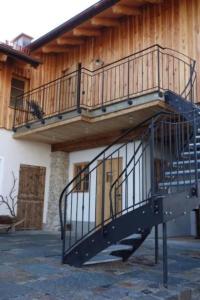 a metal staircase on the side of a building at Apartment Apartment - Monteure by Interhome in Emmering