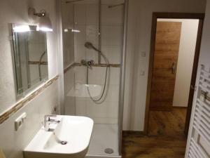 a bathroom with a sink and a shower at Apartment Apartment - Monteure by Interhome in Emmering +8 photos