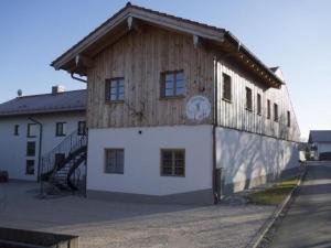 a building with a clock on the side of it at Apartment Apartment - Monteure by Interhome in Emmering